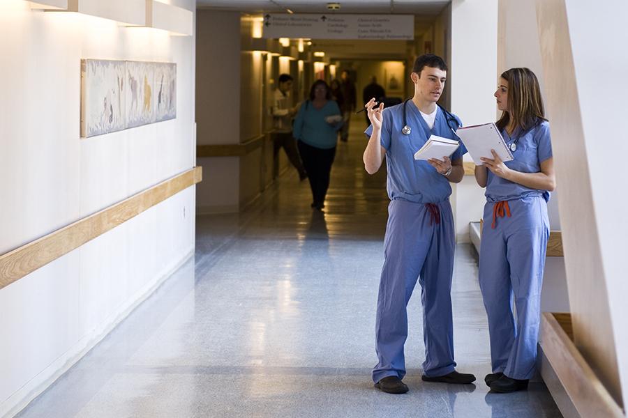 doctors talking in a hallway